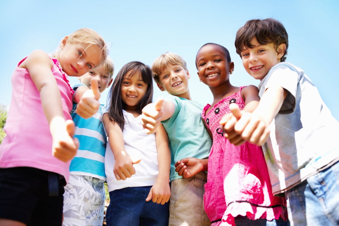 Cute kids giving thumbs up